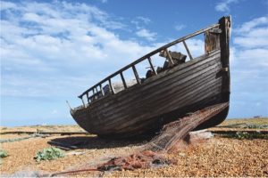 wooden boat on dunes